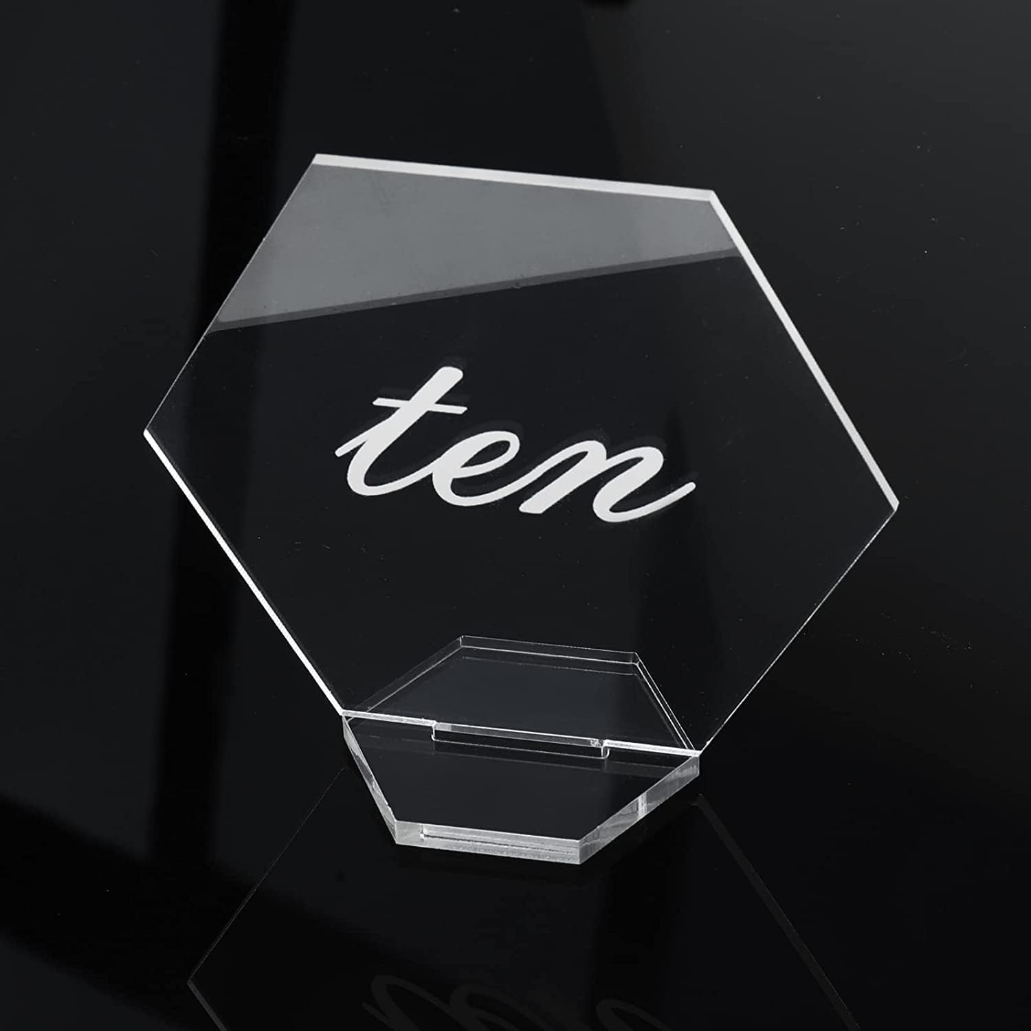 Clear acrylic table number cards featuring a hexagonal design with the number ten