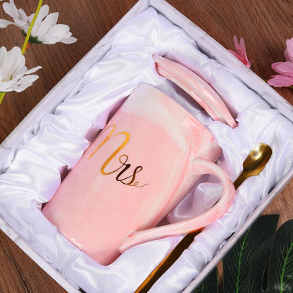 Elegant pink coffee mug for women with 'Mrs' design, presented in a gift box with a gold spoon