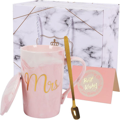 Elegant pink marble coffee mug for women with gold 'Mrs' design, spoon, and gift packaging