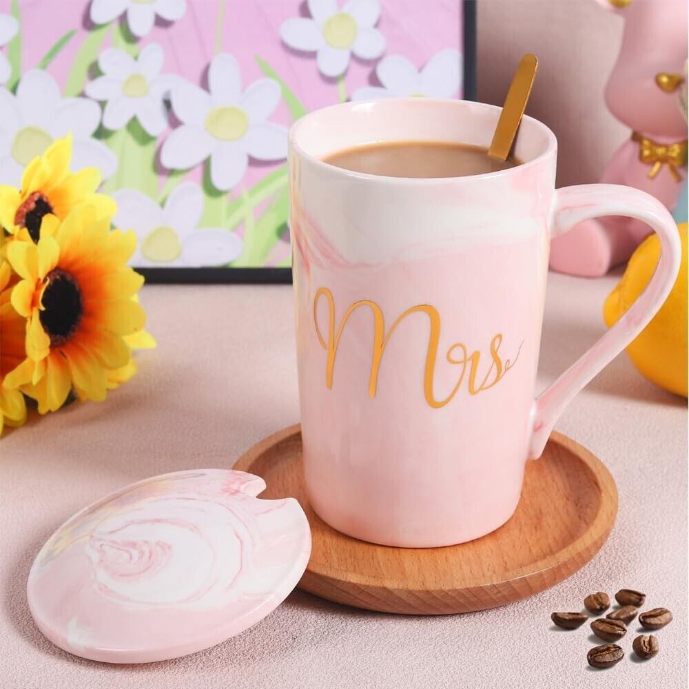 Elegant pink coffee mug for women with decorative Mrs. lettering and lid, perfect for gift giving