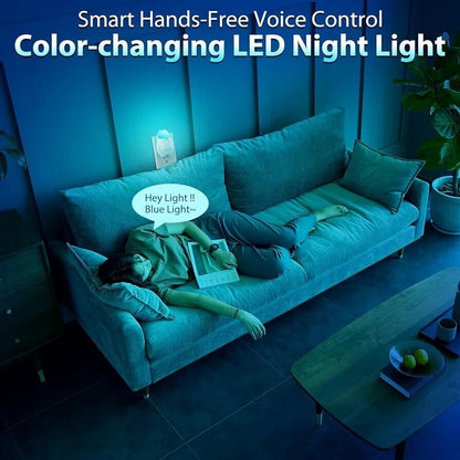 Smart colour changing night light plug in with hands-free voice control in a cosy living room setting