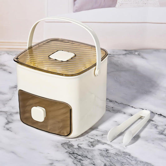Countertop ice maker machine in stylish cream and brown design with ice tongs included