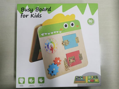 Crocodile busy board for kids featuring various interactive elements for learning and play