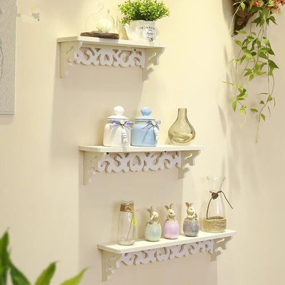 Whimsical decorative floating shelves set in white with intricate designs for stylish home decor