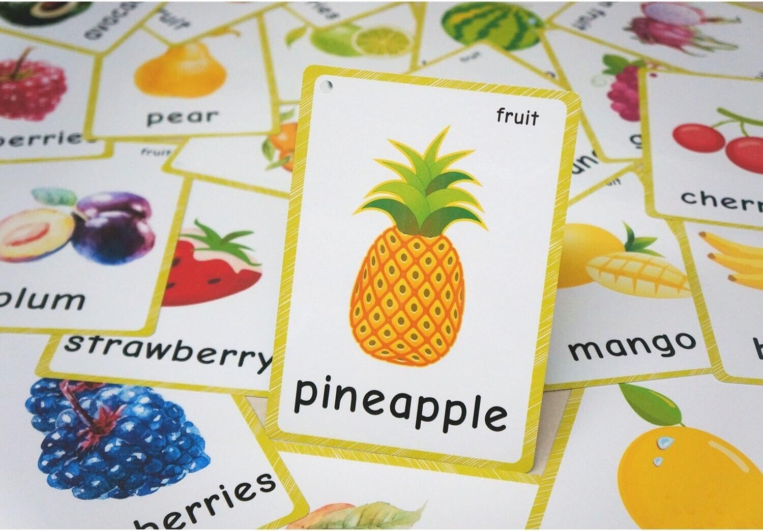 English fruit flash cards featuring a pineapple with colorful illustrations of various fruits