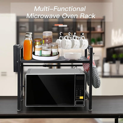 Expandable microwave oven rack with jars, spices, and mugs for kitchen storage and organisation