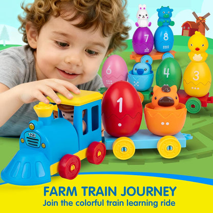 Child playing with Quanquer farm train set educational toy featuring colourful eggs and animal characters