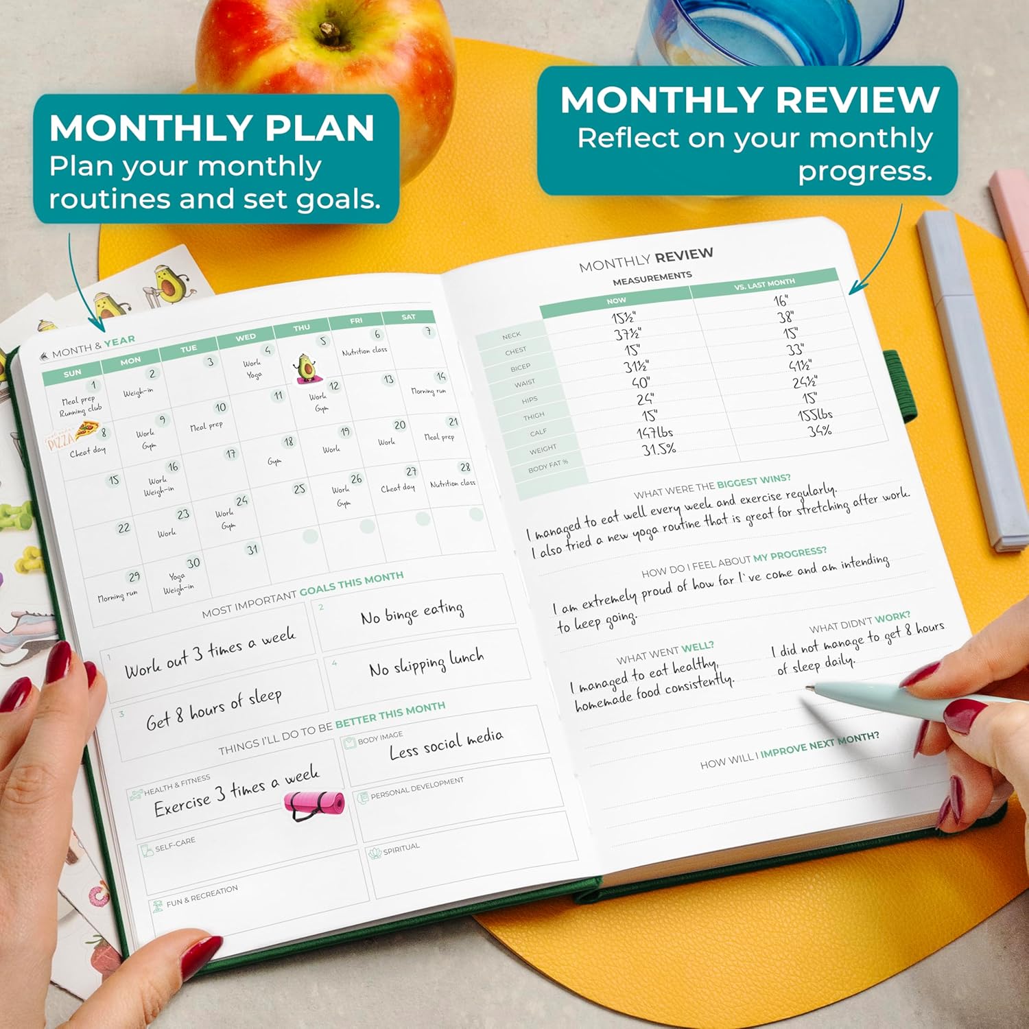 Clever Fox fitness and food journal open on a table with notes for monthly planning and review