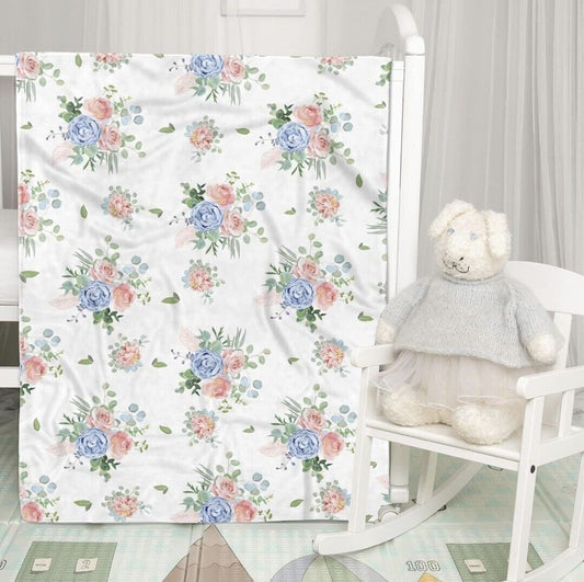 Floral Baby Blanket with Blue and Pink Roses on a White Background for Nursery Decor