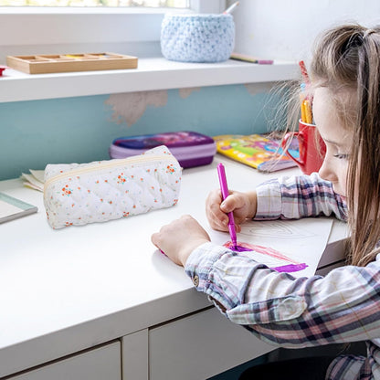 SiumPklay floral pencil case for girls displayed on a desk alongside colourful stationery items