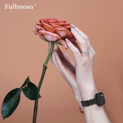 Elegant hands holding a rose while wearing a black stainless steel Apple Watch strap on the wrist