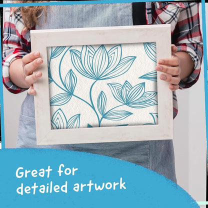 Person holding a framed artwork created with blue metallic paint markers, ideal for detailed projects