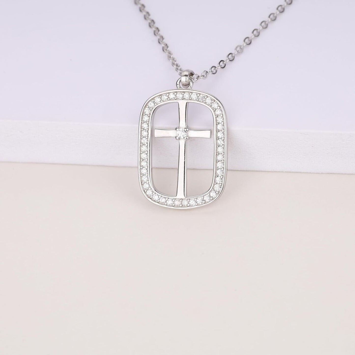 Sterling silver cross necklace for women adorned with sparkling rhinestones on a delicate chain