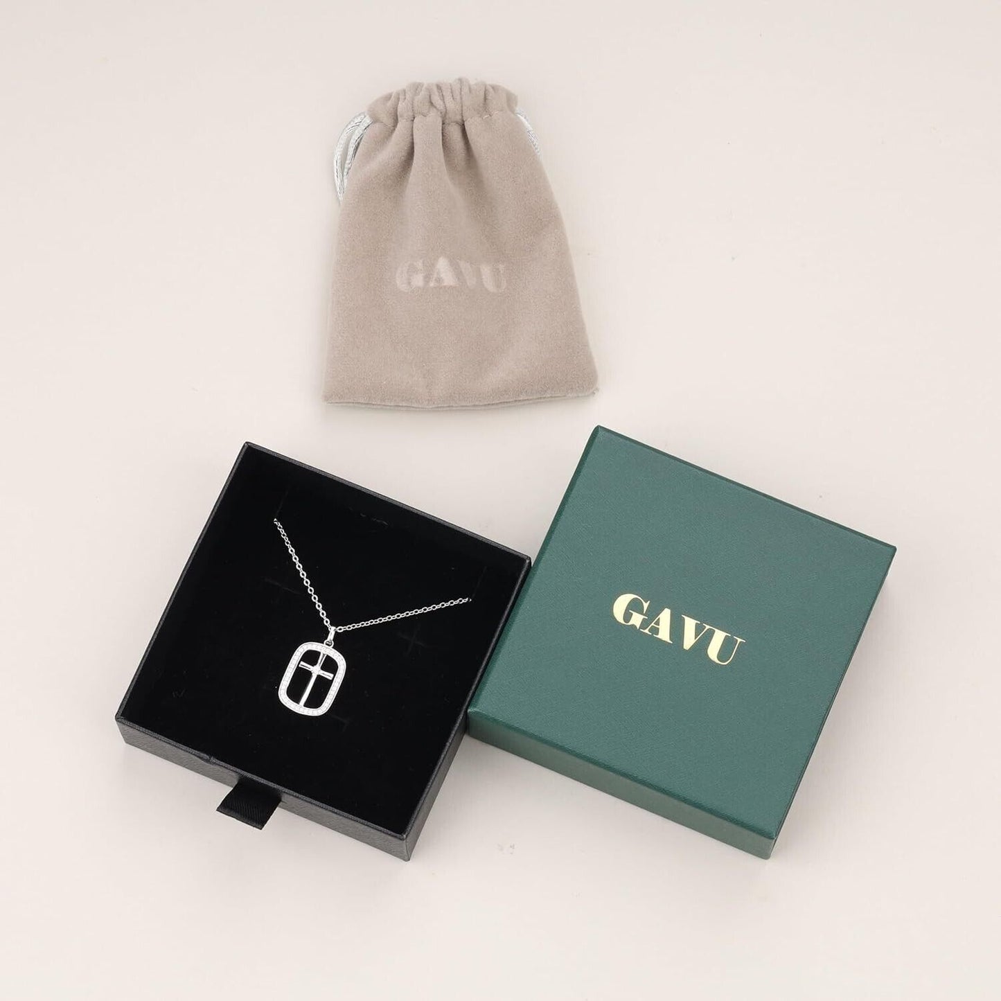 Sterling silver cross necklace for women presented in a gift box with a soft pouch