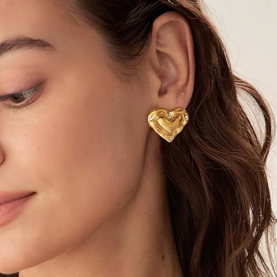 TOVABA gold heart earrings for women displayed on model, showcasing elegant style and design