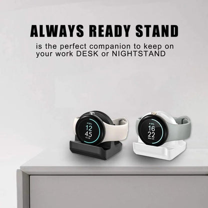 Google Pixel Watch stand displaying black and white options on a desk for convenient charging