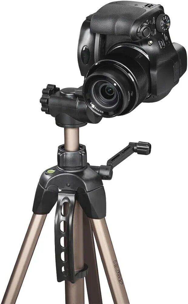 Hama Star 61 tripod with a camera mounted, featuring adjustable legs and a quick release plate