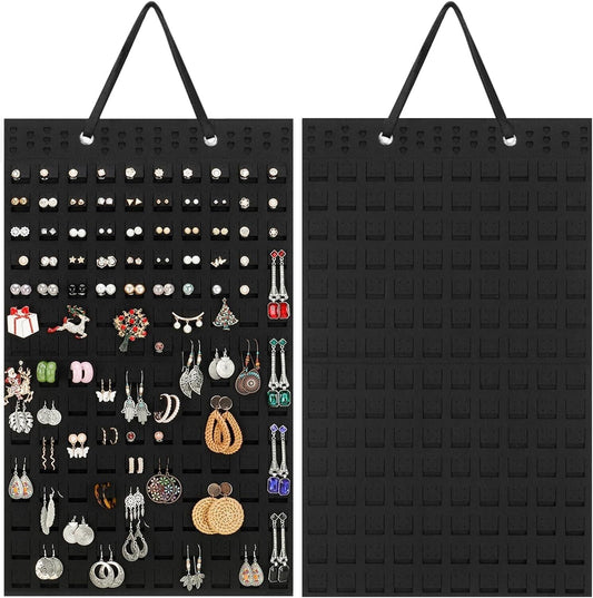 Hanging earrings holder in black fabric displaying various earrings for organised storage