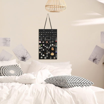Stylish hanging earrings holder displayed on a wall, perfect for organising your jewellery