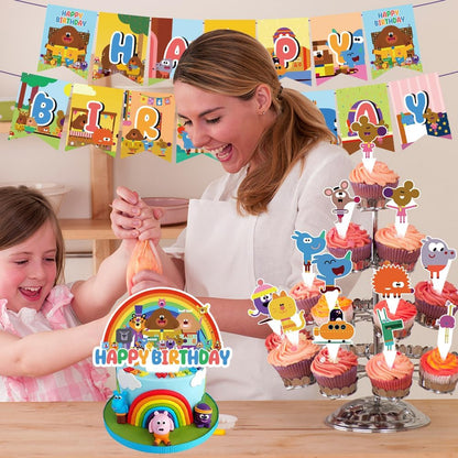 Hey Duggee birthday party decorations featuring a festive banner, cake, and colourful cupcakes at a celebration