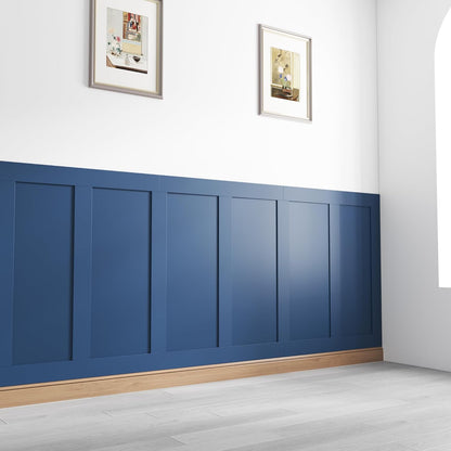 Shaker style wall panelling kit in navy blue, adding elegance to a contemporary room with framed art