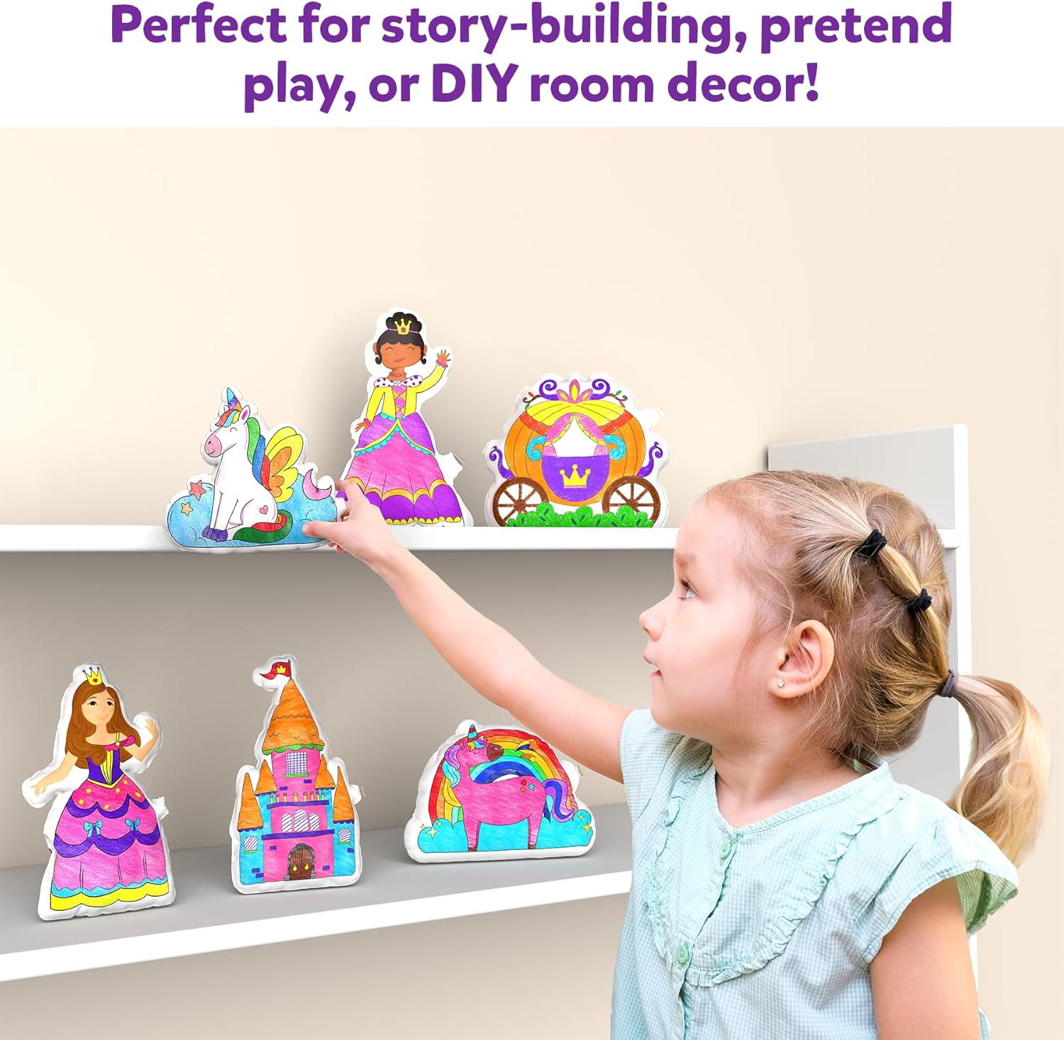Child using the inflatable art kit for kids to create decorative story elements on a shelf