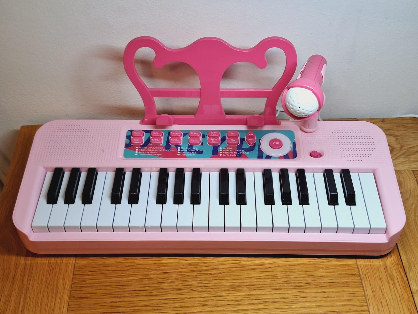 Fascinating pink kids piano keyboard with microphone for interactive musical play
