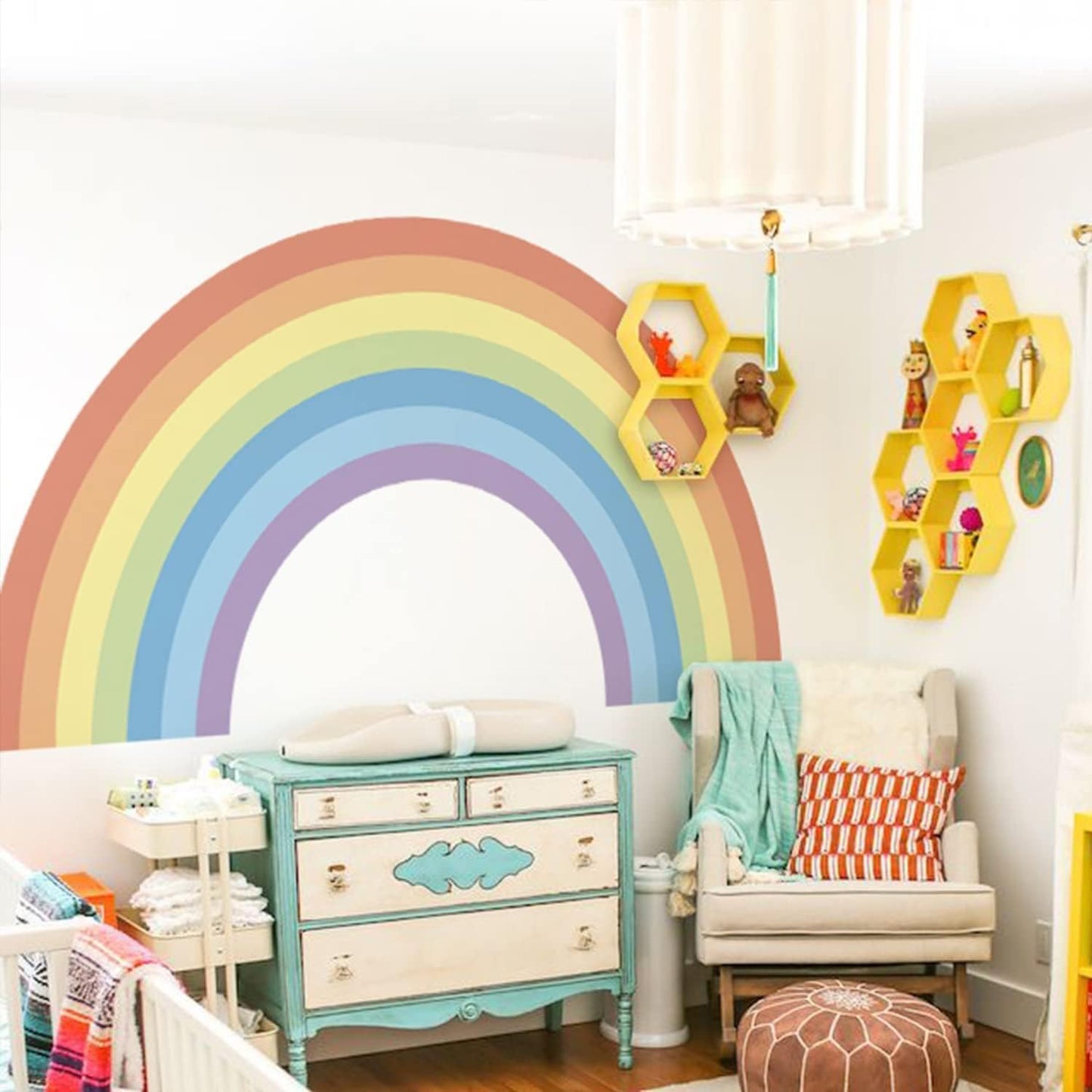 Large pastel rainbow wall stickers creating a vibrant decor accent in a stylish nursery