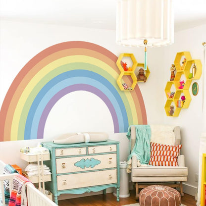 Large pastel rainbow wall stickers creating a vibrant decor accent in a stylish nursery