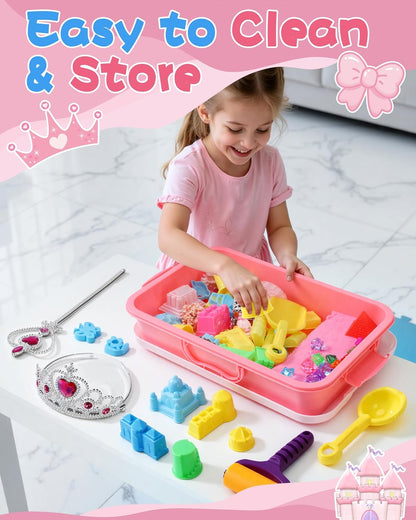 Child playing with magic sand castle set for kids in pink storage box with various moulds and tools