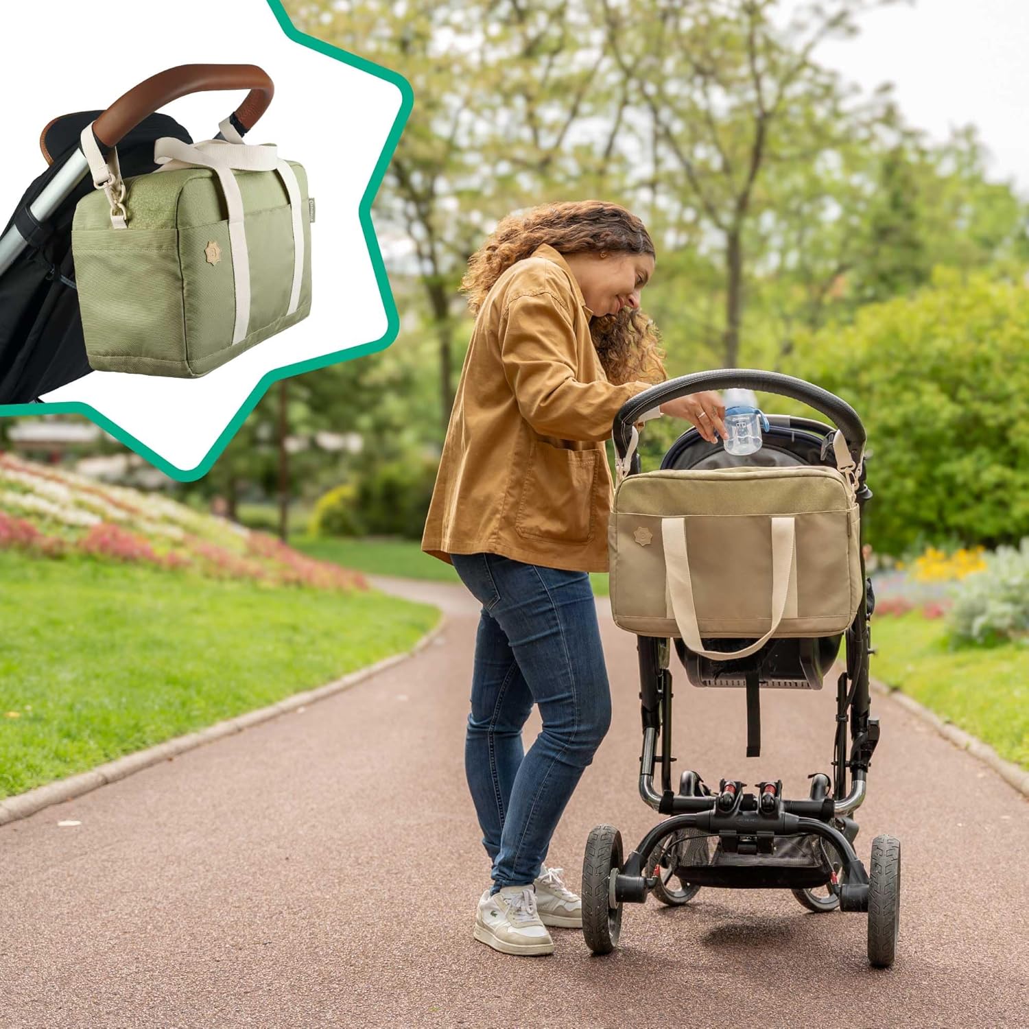 Olive baby changing bag by Badabulle attached to a stroller, perfect for parents on the go