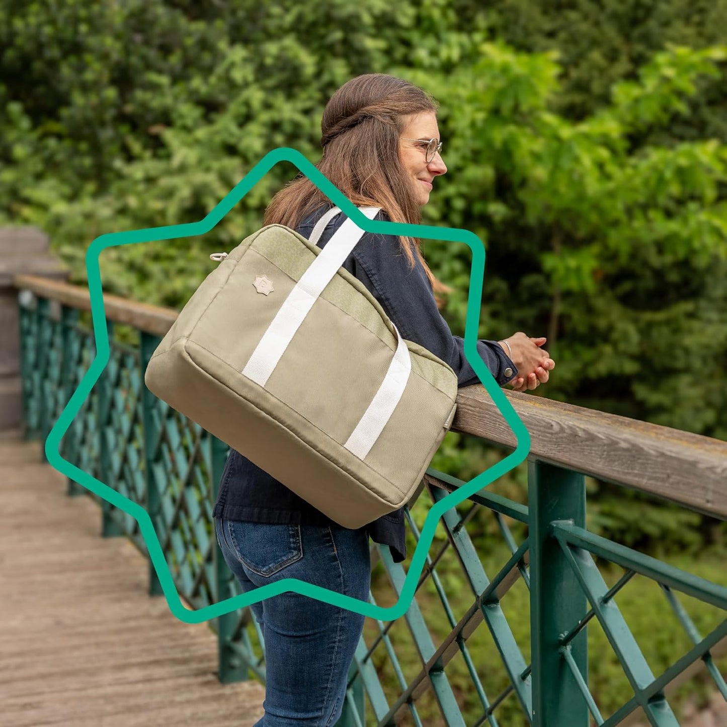 Stylish olive baby changing bag by Badabulle with adjustable straps for parents on the go