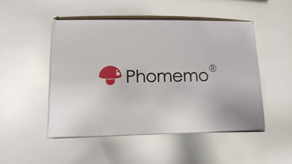 Phomemo M220 portable barcode printer packaging featuring the Phomemo logo on a white box