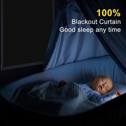 Portable blackout blind in use, providing complete darkness for a sleeping baby in a crib
