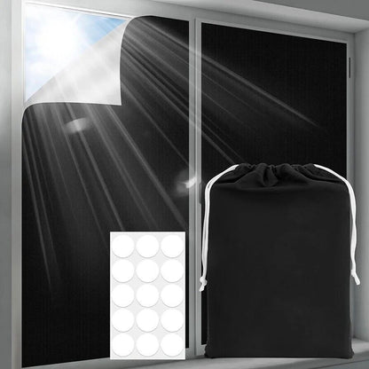 Portable blackout blind with adhesive attachment for easy installation and a drawstring storage bag
