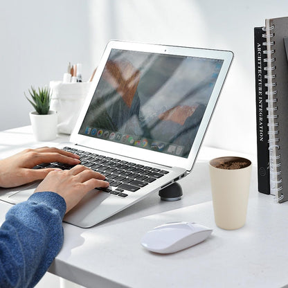 Eco-friendly beige reusable plastic drinking cups on a white desk beside a laptop and mouse