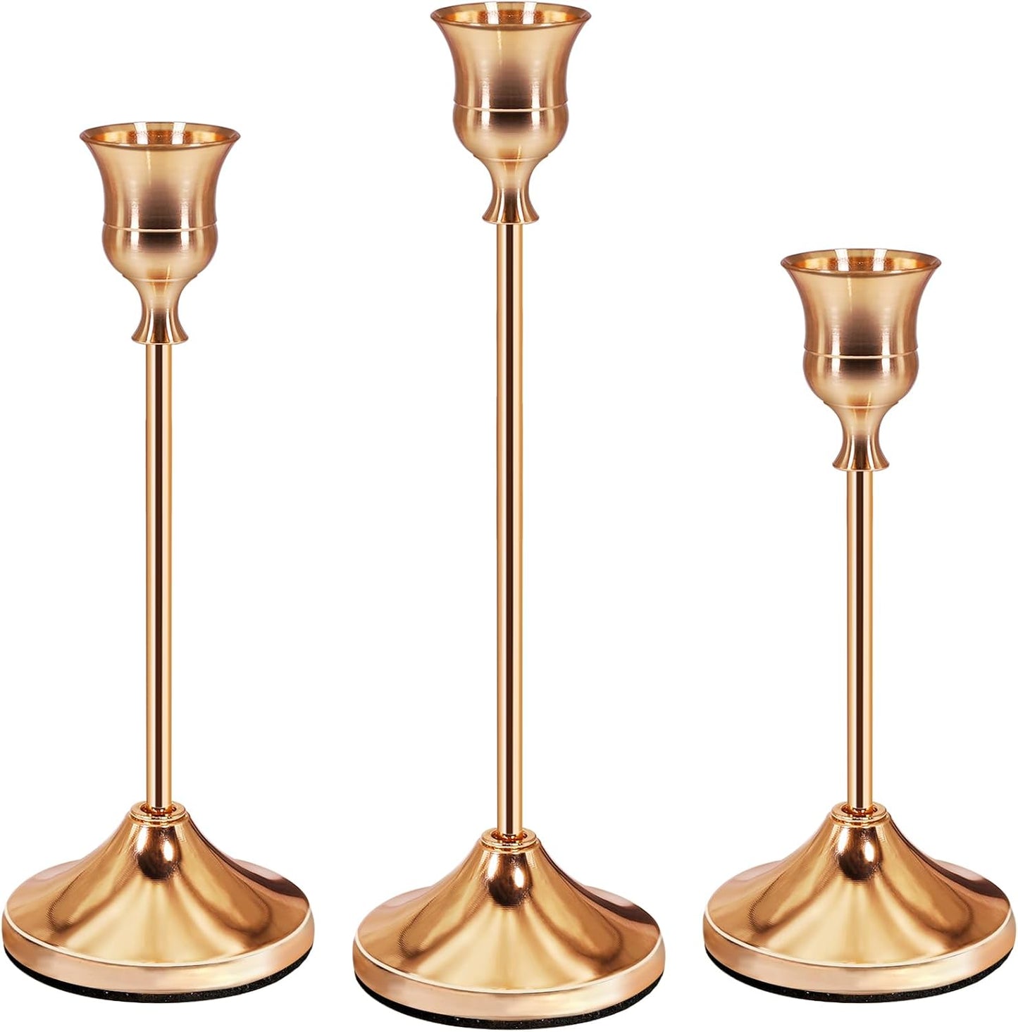 Set of three elegant rose gold candle holders with varying heights for stylish home decor