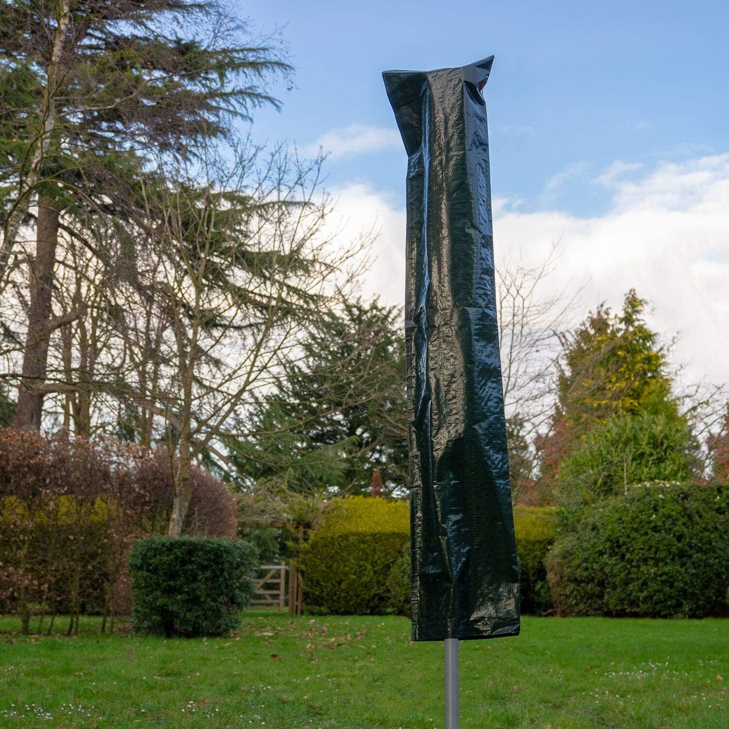 Home Treats rotary airer clothes line with protective cover in a garden setting