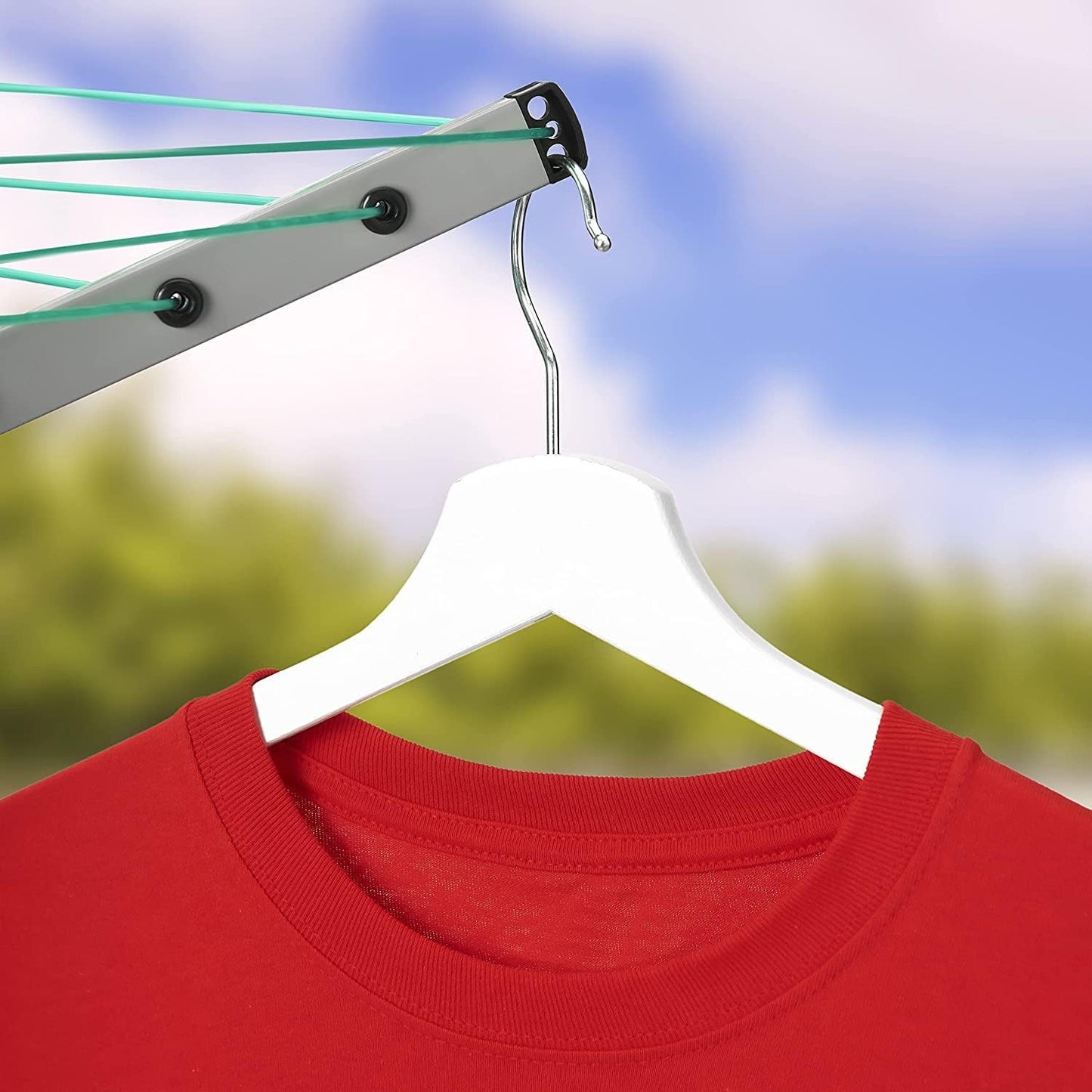Home Treats rotary airer clothes line with a red shirt hanging on a white hanger outdoors