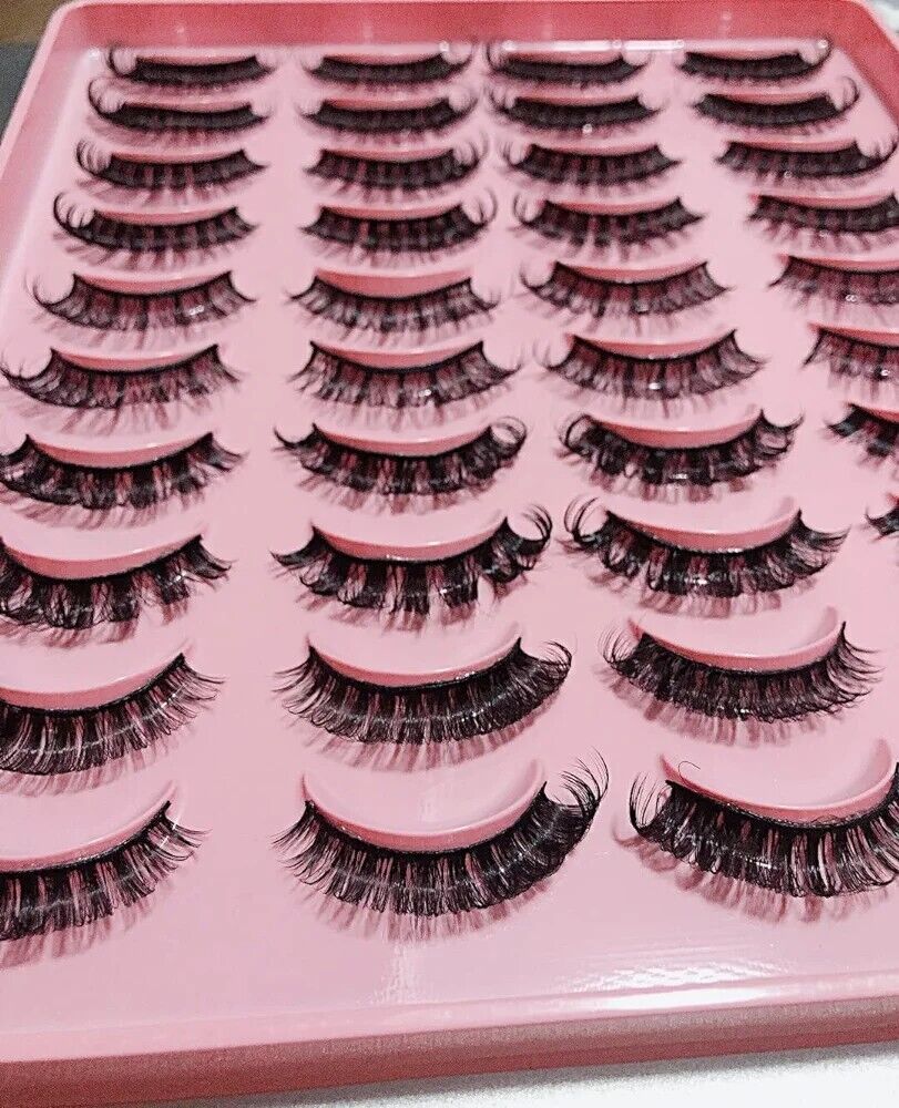 A variety of luxurious Russian strip lashes displayed on a pink tray, perfect for enhancing eye makeup
