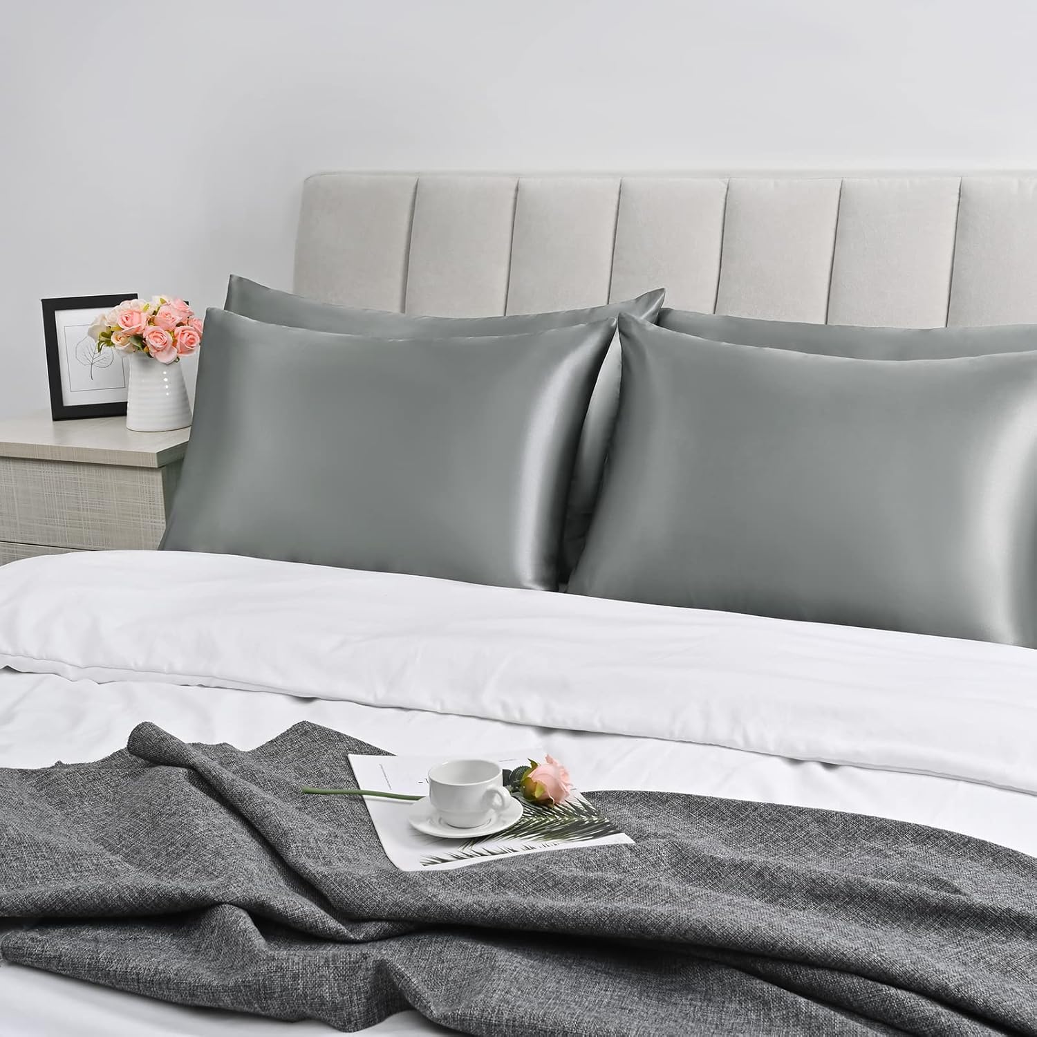 Bedcozy grey satin pillowcase for hair and skin on a neatly made bed with decorative accessories
