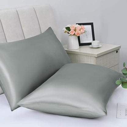 Bedcozy satin pillowcase for hair and skin in soft grey colour on a neatly made bed