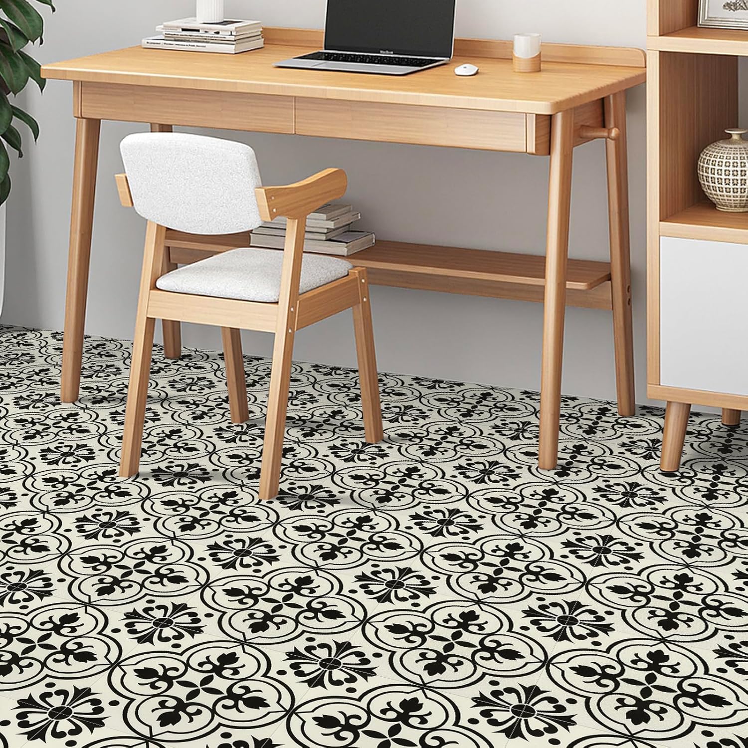 Stylish NUFLR self adhesive floor tiles 30cm x 30cm featuring a black and white floral pattern in a modern workspace
