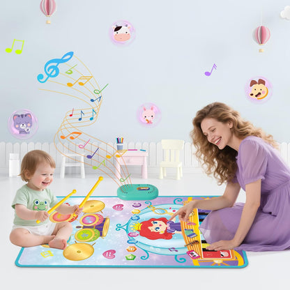 Child playing on a colourful 3-in-1 piano drum mat for kids with musical elements and a smiling adult