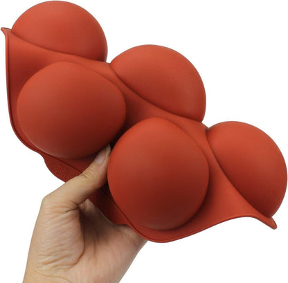 Flexible silicone chocolate mould featuring round cavities for creating shaped chocolates