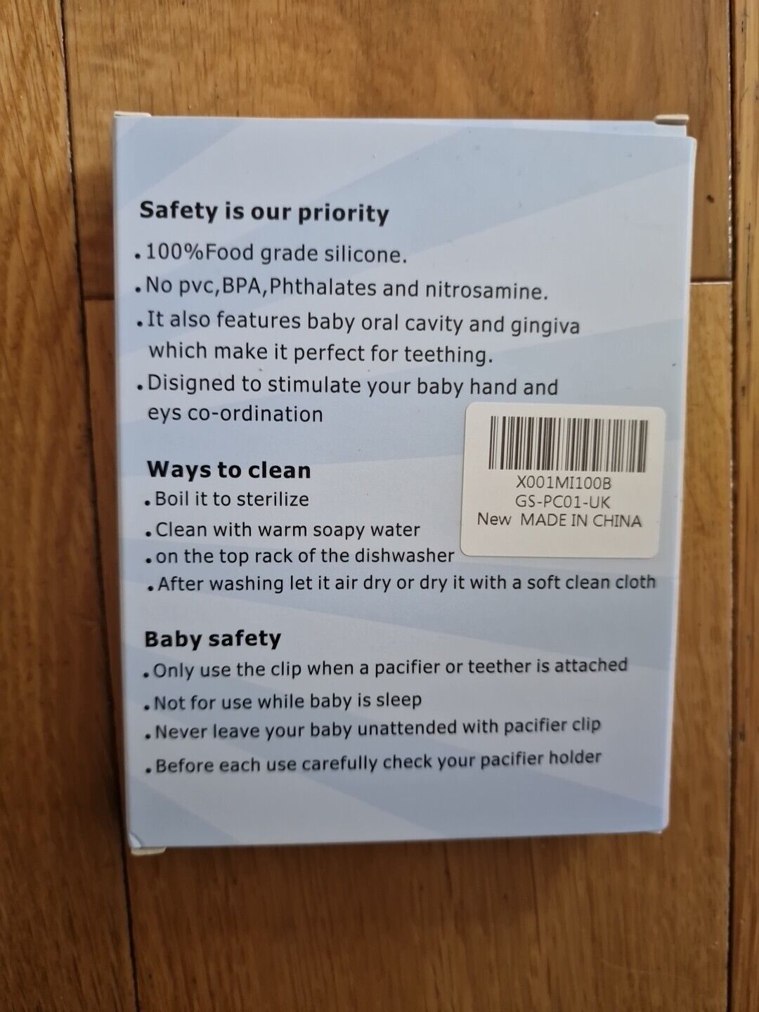 Silicone pacifier clip instructions, highlighting safety and cleaning tips for baby care