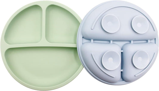 Two silicone suction toddler plates in green and blue with divided sections for easy meal serving
