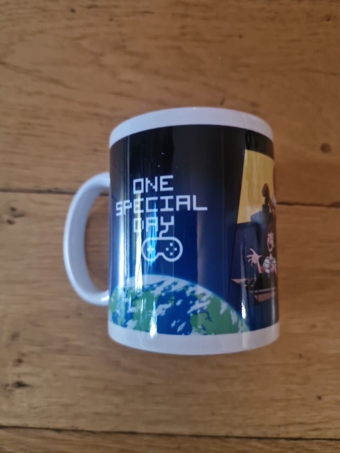 Special Effects 15th Anniversary mug featuring gaming graphics and a vibrant Earth design