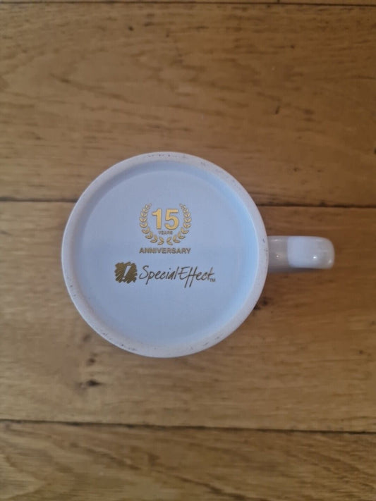 Special Effects 15th Anniversary mug featuring a gold celebration design on the base