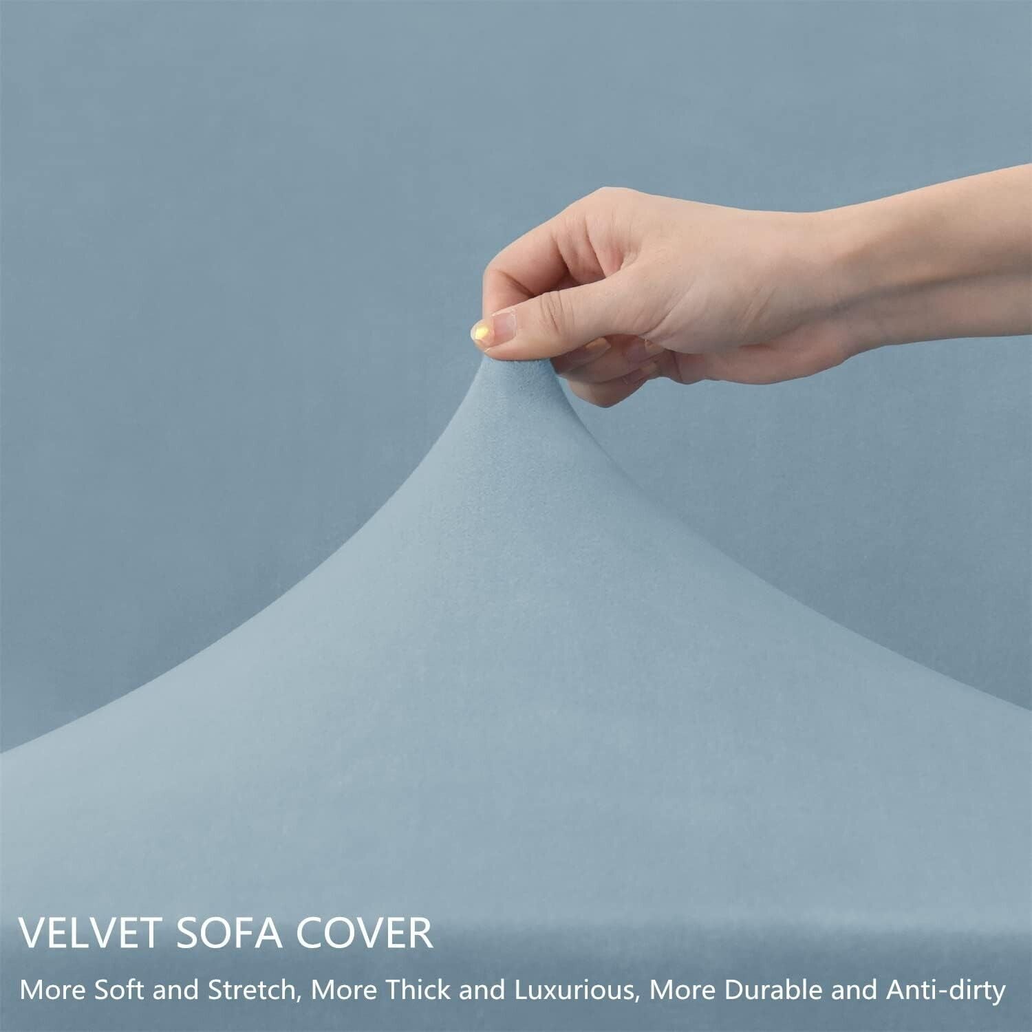 Hand showcasing the soft texture of a stretch velvet sofa slipcover in light blue